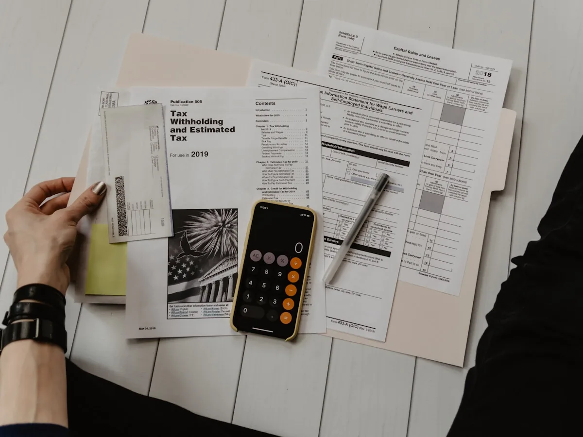 Financial analysis charts and business documents on professional advisor desk